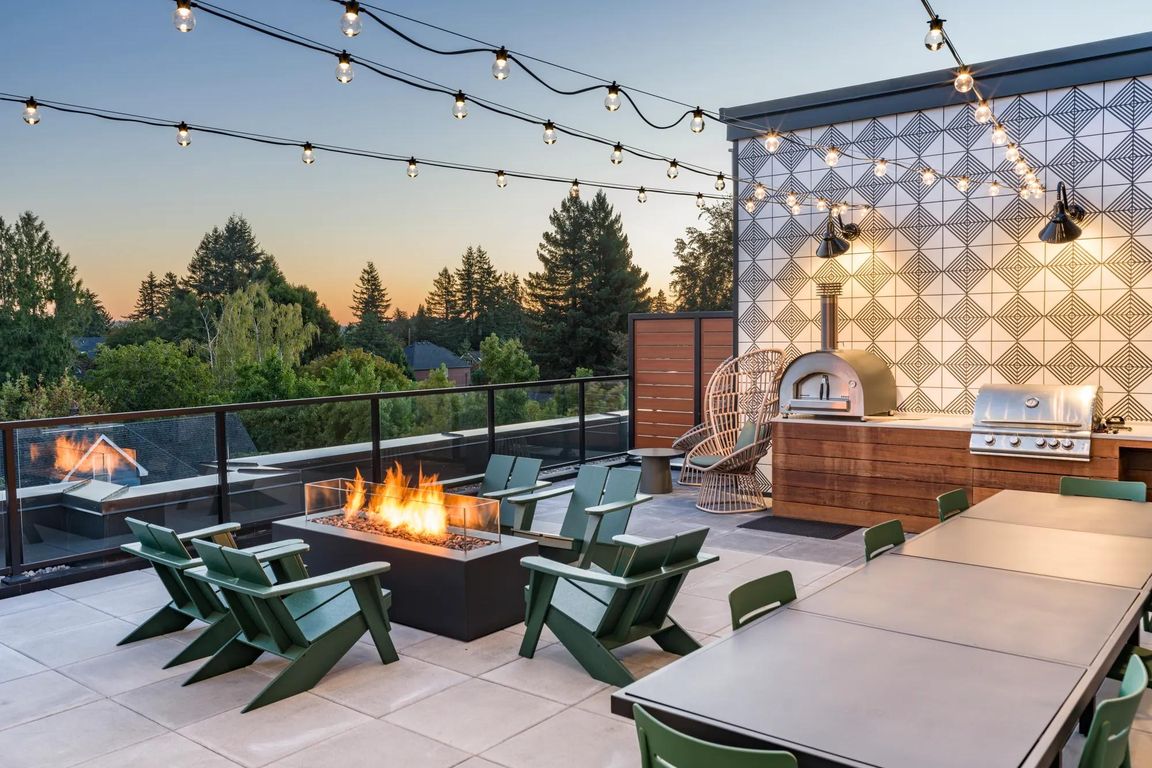Ascend to the 5th floor retreat featuring a TV lounge, fireplace, full kitchen, and an outdoor terrace equipped with a grilling station and pizza oven.