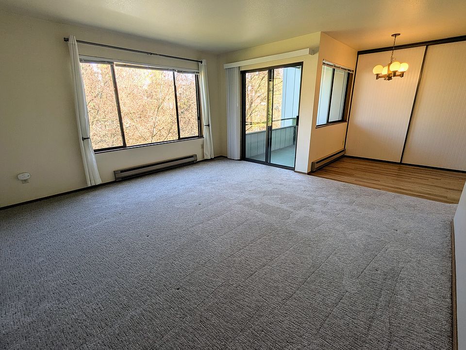 Living room and dining room with balcony access