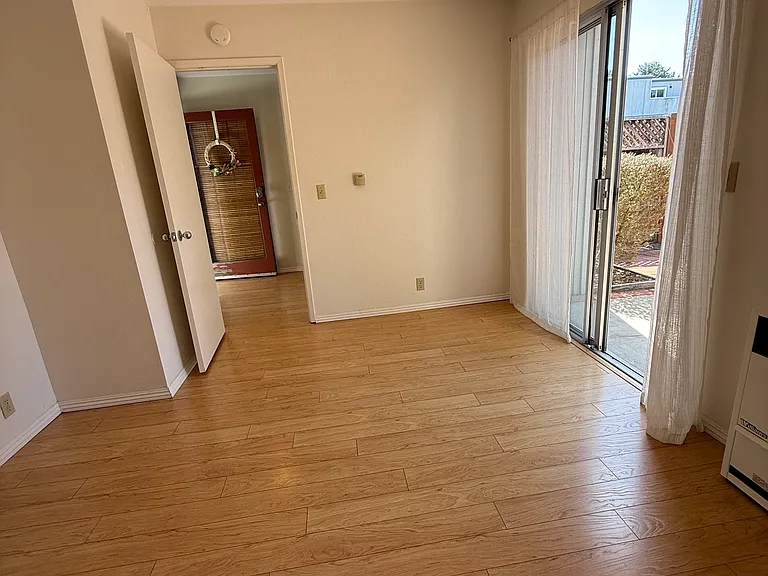 Downstairs bedroom with patio access