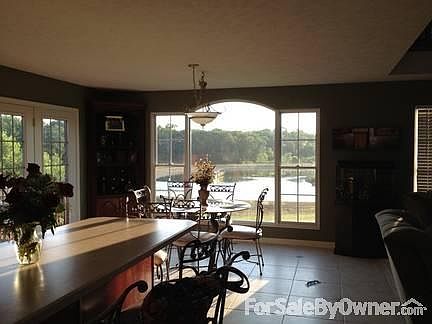 Living area- vaulted ceilings, fireplace
						:
						Extra large doermer window, lake view, surround sound built in, cherry fireplace