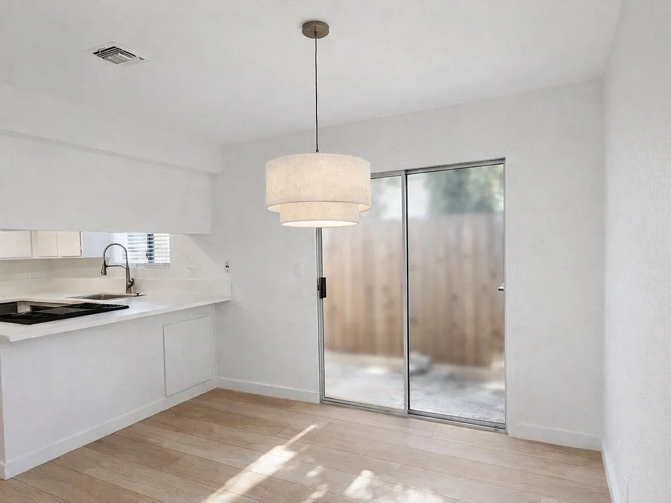 Dining area off of kitchen, slider access to rear private patio.