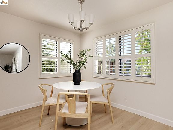 Separate Dining Area with ample lights and views of the garden.