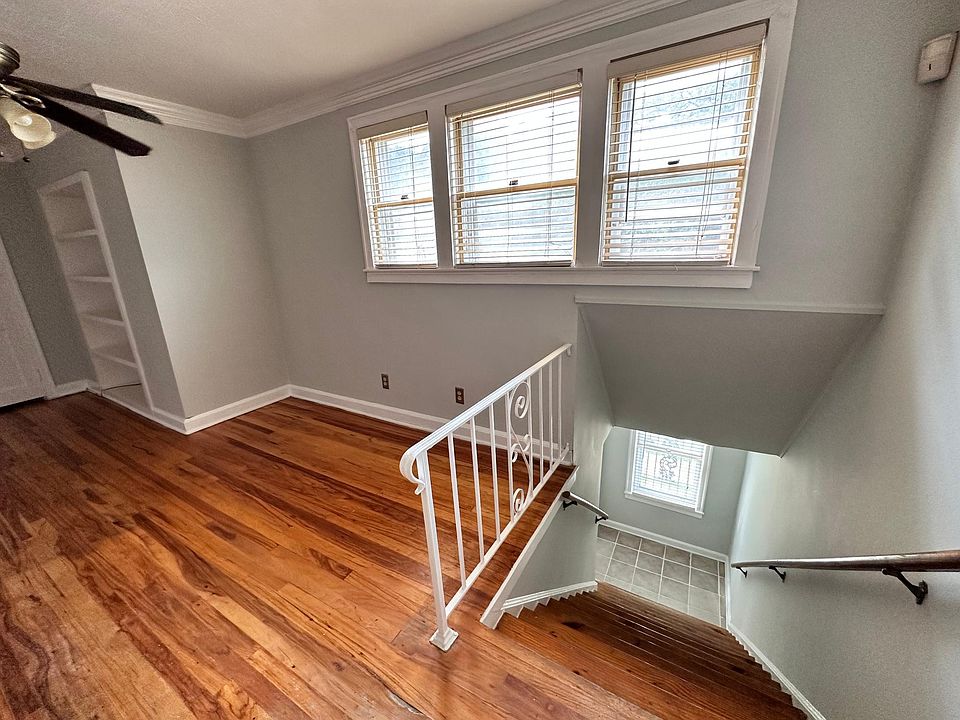 Bright welcoming stairwell with small landing