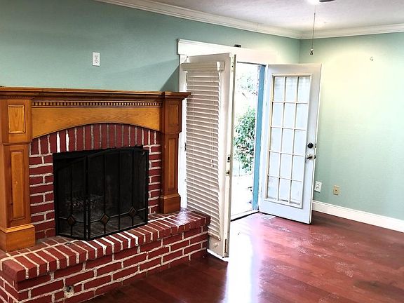 Fireplace with 2 sets of French doors