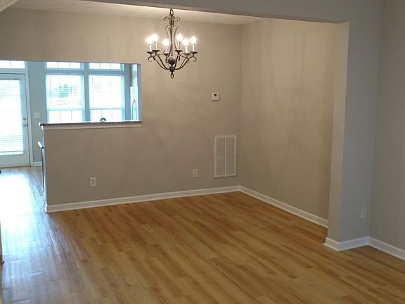 View of living room and dining room from front entry.