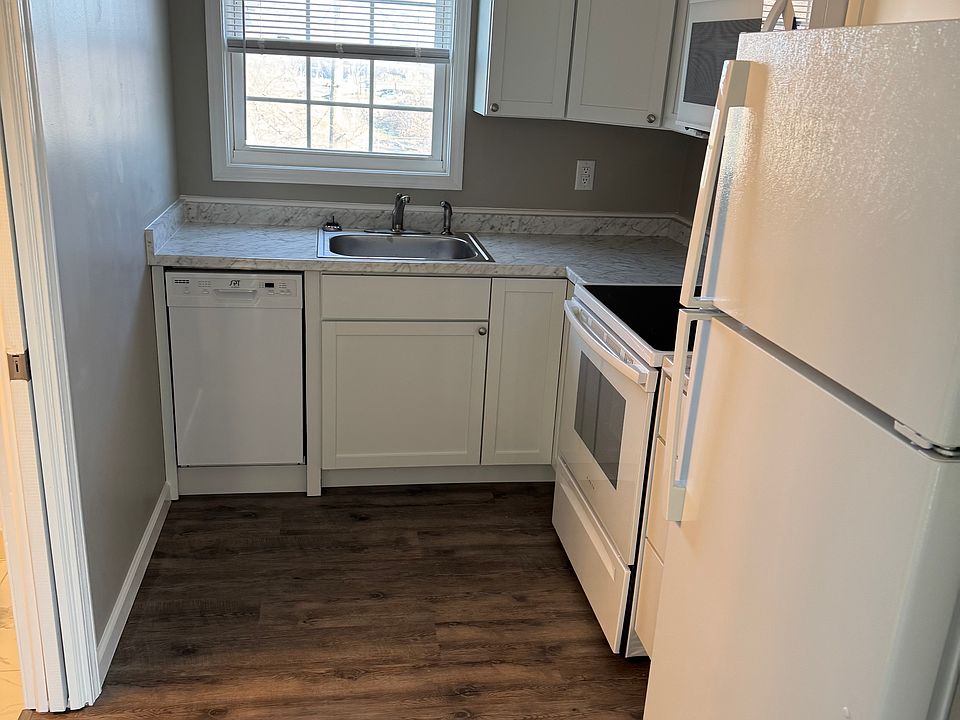 Kitchen with new cabinets, flooring and appliances.