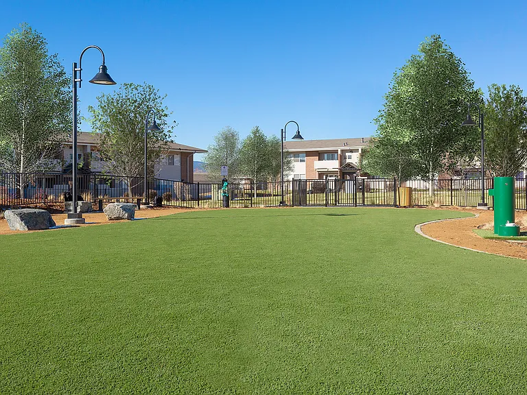On-site pet park with seating, water station, and bag stations located throughout