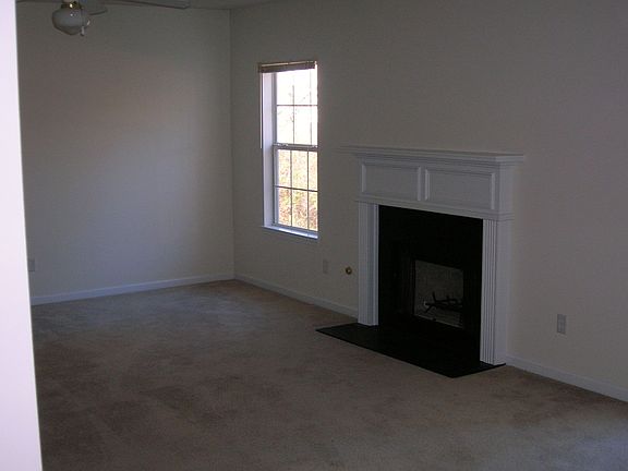 Family room off kitchen with door to back patio and gas fireplace.