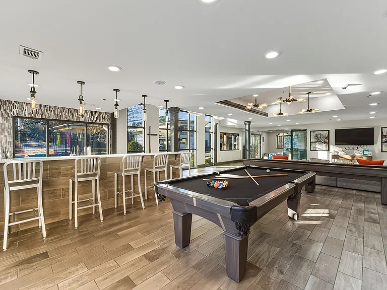 Resident clubhouse with kitchen, billiards, and lounge areas