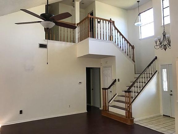 Living room leading to upstairs