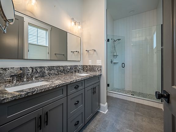 Primary Bathroom with Dual Sinks and Large Shower