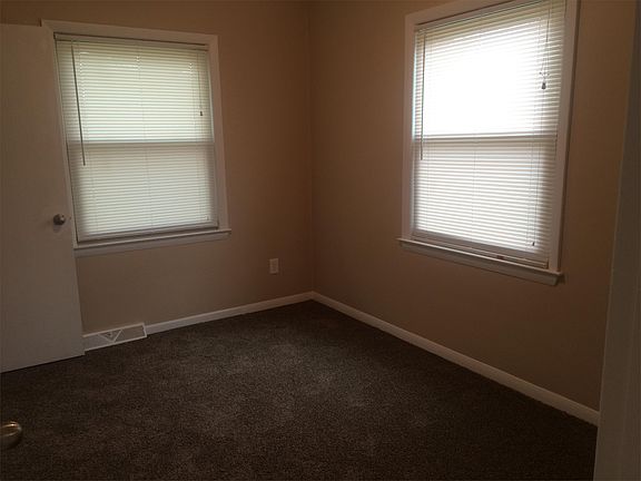 spacious main floor office with new carpet