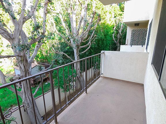 Spacious private balcony with peaceful treetop views
