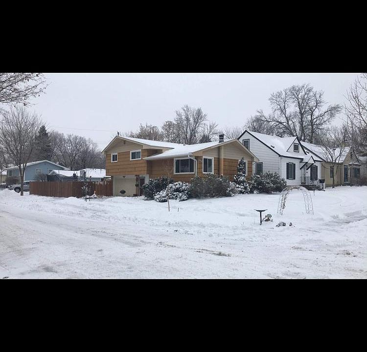Corner lot with garage parking and fenced in backyard.