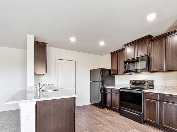 The kitchen comes with a full suite of energy-efficient appliances