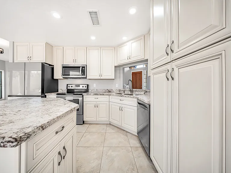 Kitchen with ample cabinets and an island.