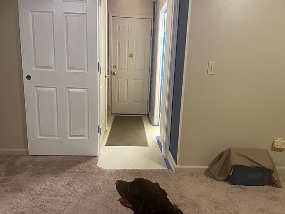 Entryway from garage with 1/2 bathroom on the left as you enter. ( Full bath up stairs)