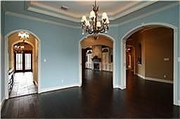  Formal dining for your entertaining pleasure.  Custom wood floors installed by owner.