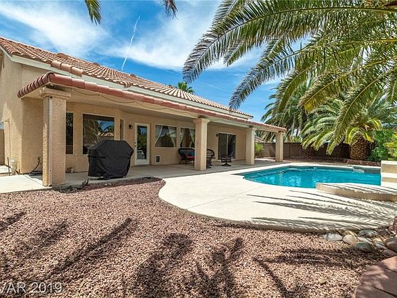9000 + sq ft lot with 45' covered patio and sparkling pool...