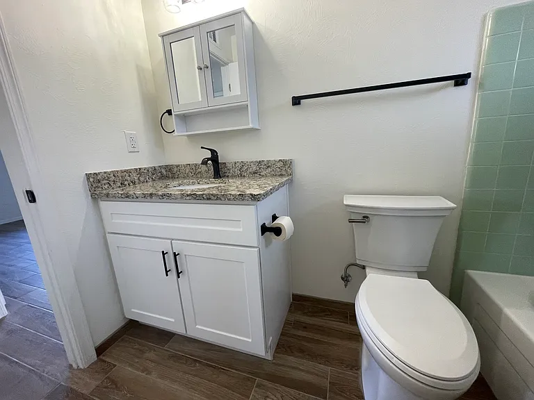 Hallway Bathroom w/ granite vanity