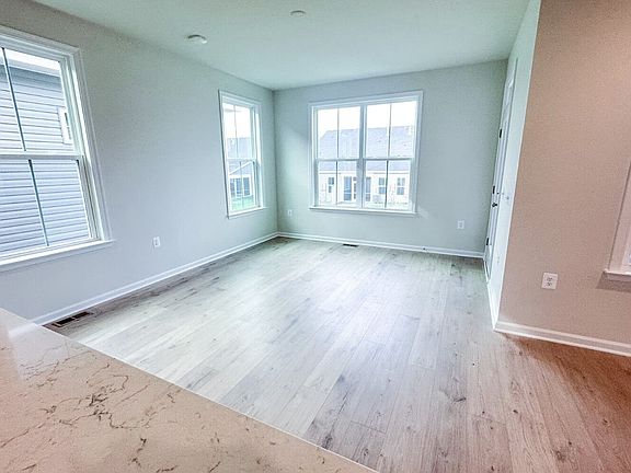 The dining room in the Matisse on homesite 1019 at Hiatt Pointe at Snowden Bridge by Brookfield Resi