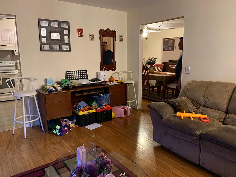 Back View of Family Room - again with Tenant Residing. See other picture with it being empty - current state when the new tenants will move in.