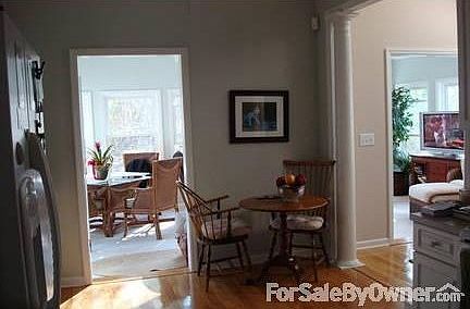 Kitchen to Sunroom : Vaulted ceilings with skylights from kitchen view to sunroom