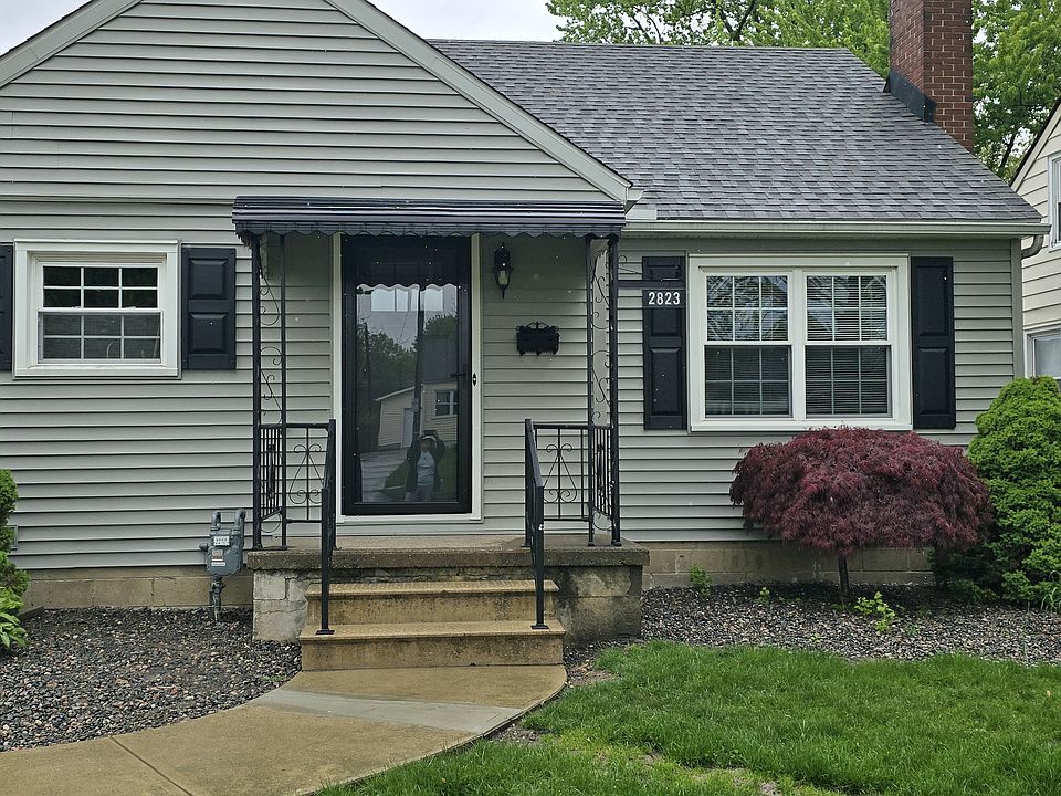 Siding just completed. new shutters, new doors and in process of restoring the flower beds and lawn