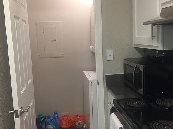 View of laundry room from kitchen. 