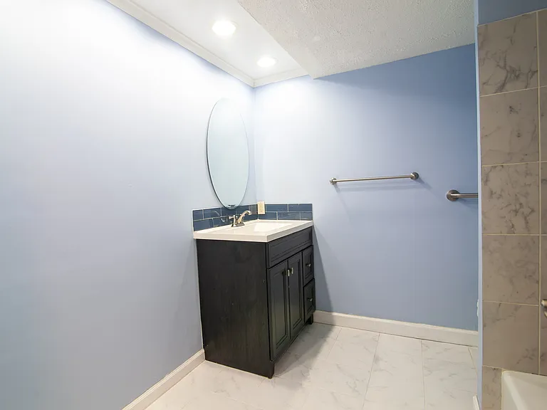 Guest bathroom with grab bars