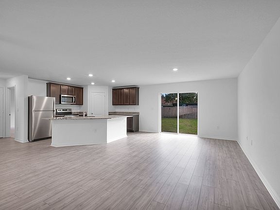The oversized, covered back patio will allow you to entertain outdoors year-round.