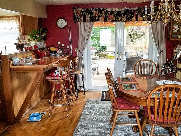 Enter front door to dinning & living room. French doors lead to covered deck.>