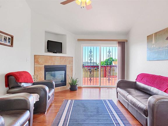 Welcoming Great room with gorgeous wood flooring, vaulted ceilings, walkout and