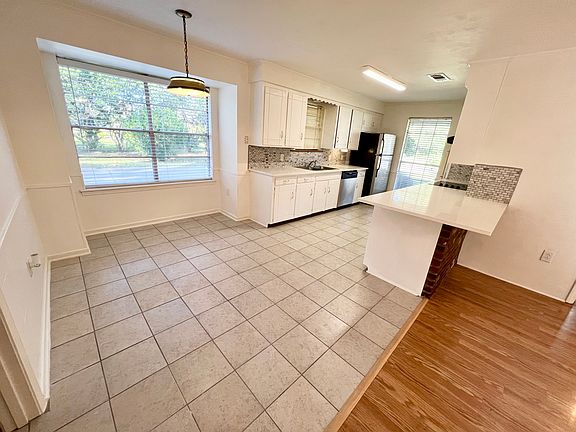 Kitchen and dining area view from the living room.