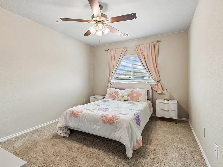 secondary bedroom with large walk in closet