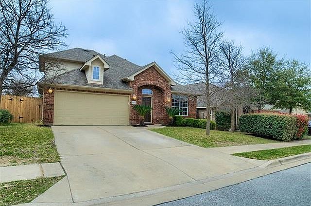 The exterior has great street appeal with a two-car garage that compliments the facade.