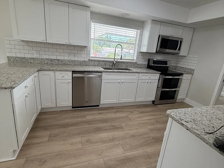 Kitchen, electric range, microware, dishwasher, disposal