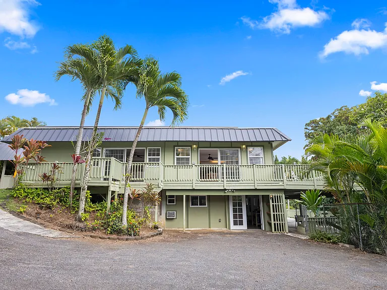 Side view of the home. Rental includes the upstairs unit only.