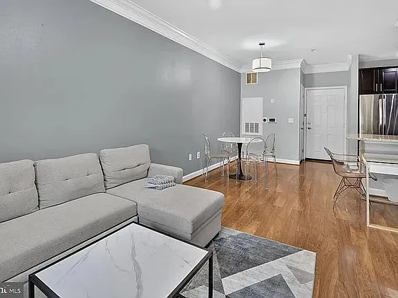 Welcome to this bright and spacious condominium offering an open-concept floor — Photo 2