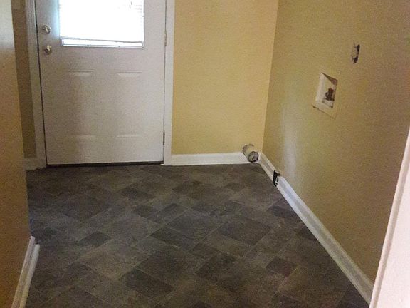 Laundry room and backdoor to huge deck and yard.