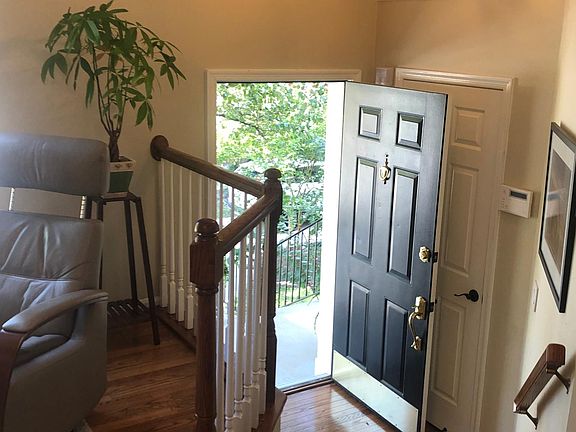 Georgetown black entry door, subtle and interesting lighting fixtures.