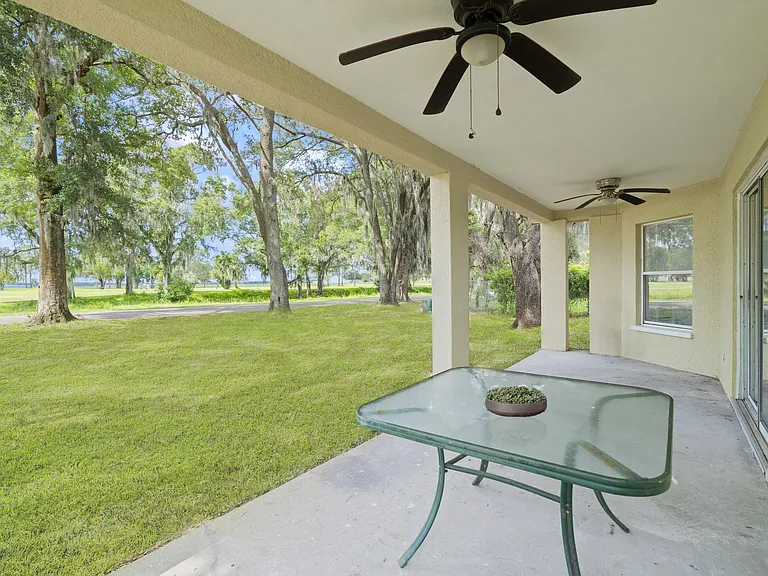 Shaded rear patio that is across from the park.