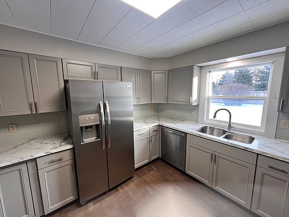 Kitchen with window facing backyard.