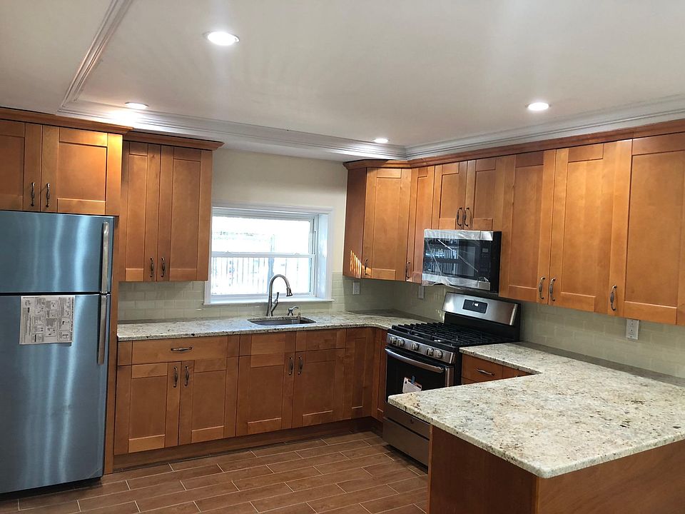 Newly renovated kitchen, new tiles, stainless steel applianc