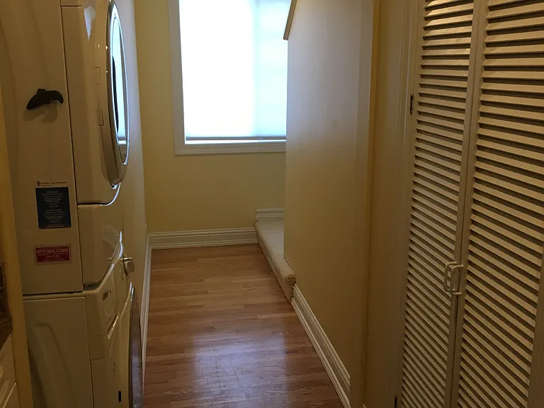 Laundry with storage and shelving. Also two closets on far right, not shown with garage entry. Home has security system.