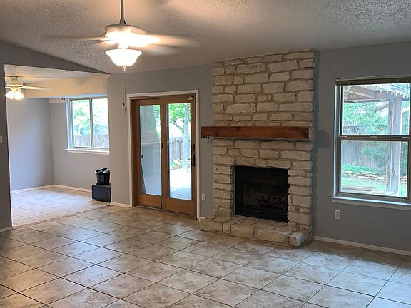 Walking into the Den with a view into dining area... past the sliding glass door..