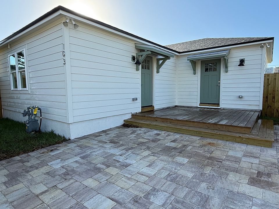 side entry with wood deck.