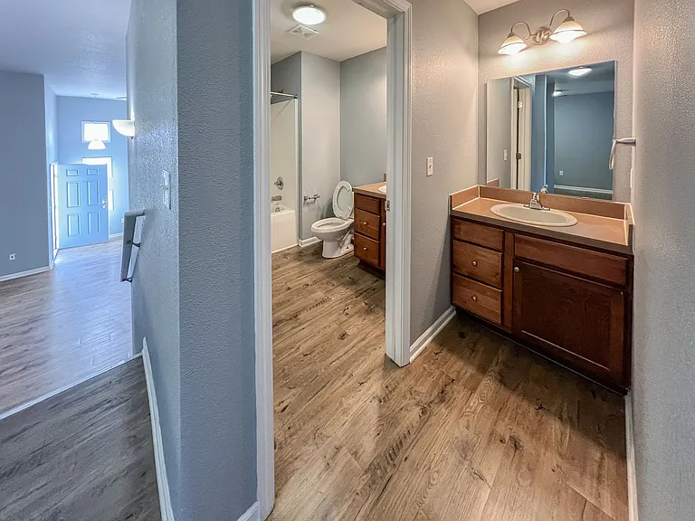 Split level top floor bathroom with extra sink