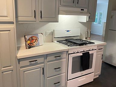 Newly remodeled with quartz countertop and backsplash. All white appliances are included.