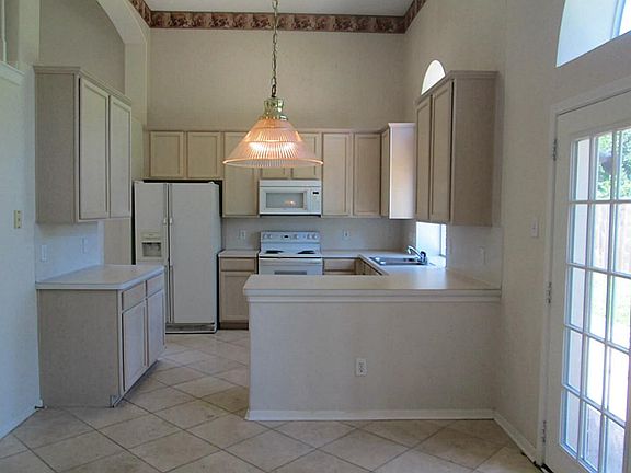 The kitchen offers abundant cabinet/counter space.